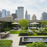 Luxurious rooftop garden with dining, lounge, and gardening zones overlooking a city.